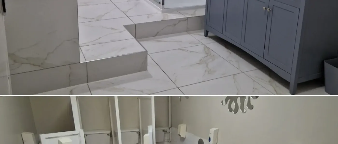 Full marble bathroom renovation with glass shower enclosure and double vanity