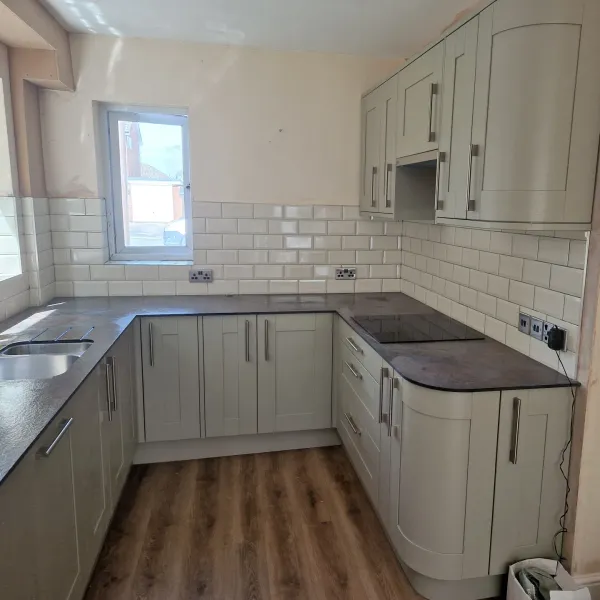 White metro tile backsplash with grey shaker kitchen units