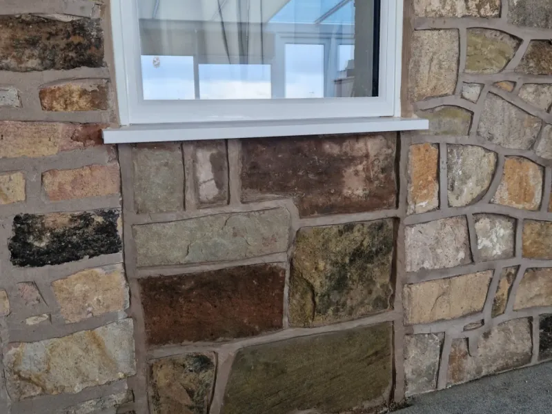 Natural stone exterior wall with window surround